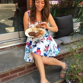 Jackie eating gluten free baked goods from Market Ipanema